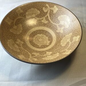 Elegant ceramic bowl with intricate, decorative patterns from Sound Collection.